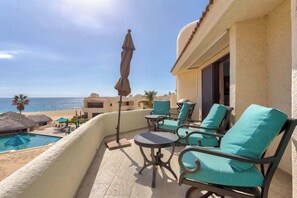 Take in breathtaking ocean views from your comfy balcony seating.