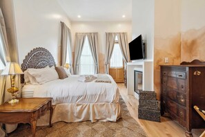 Upstairs Bedroom 3 with King Mattress, En Suite Full Bathroom, Desk, Gas Fireplace, Closet, Smart TV and Private Patio Access