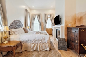 Upstairs Bedroom 3 with King Mattress, En Suite Full Bathroom, Desk, Gas Fireplace, Closet, Smart TV and Private Patio Access