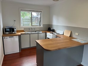 Kitchen with microwave, dishwasher, stove