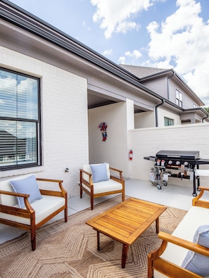 Private patio with outdoor seating and grill for perfect evenings