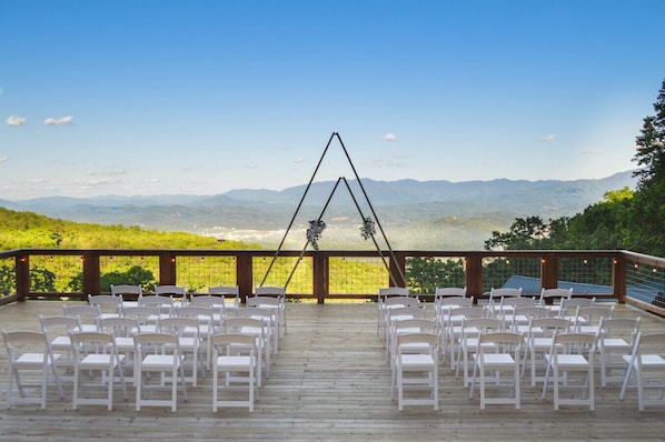 Welcome to The Grand Haven — two luxurious cabins, one private 1,280 sq ft wedding deck, and a sweeping mountain view for your perfect day.