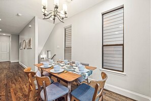Spacious dining table that sits 6 with full tableware and silverware included.