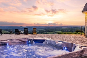 Slip into the luxurious Hot Springs Hot Tub, seating 7 guests, for the ultimate experience of showcasing a sunset over the town of Wellsboro.