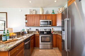 Enjoy a fully equipped kitchen with wood cabinetry and ample space NAP-B13