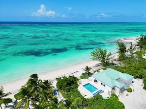 Aerial view of the beach, pool and house