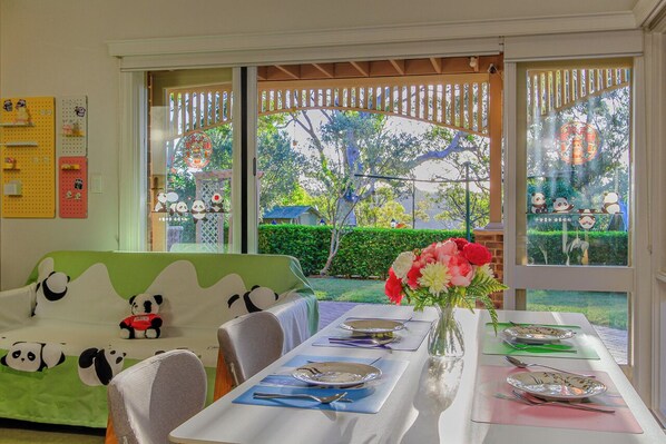 Enjoy the garden view when having your meal. Afternoon sun will fill the space.