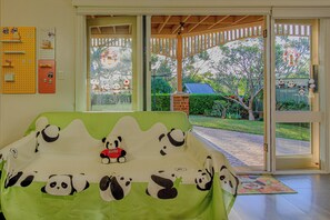 Sofa bed under cover. Private access with smart lock from backyard.