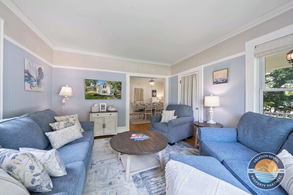 Bright, cozy living room perfect for relaxing after a Lake Geneva day.