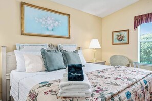 Large king sized bed with extra pillows for a comfortable night sleep.