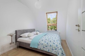 The bedroom's elegant decor creates a serene and restful environment.