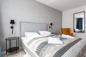 Comfortable double bed in the bedroom. 