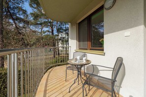 Balcony with garden furniture.