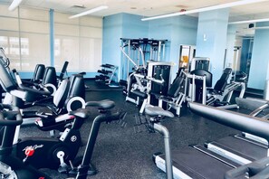 Fitness room with bikes, treadmills, and weight machines