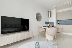 A living room with a wall-mounted TV and elegant interior decor combines functionality with aesthetics.