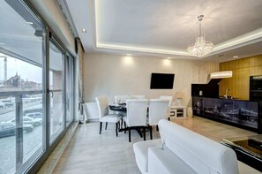Bright and airy dining space with chic white upholstered chairs, perfect for memorable meals.