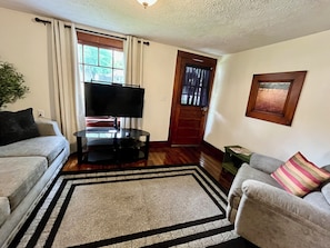 Living room opening to front porch and eating/kitchen area