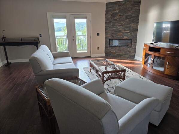 Open concept living room with balcony access