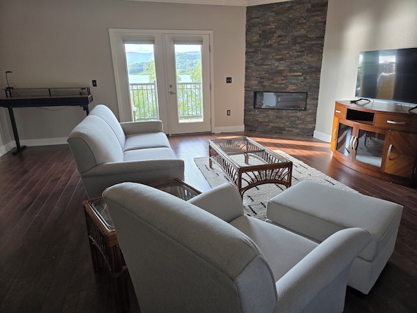 Open concept living room with balcony access