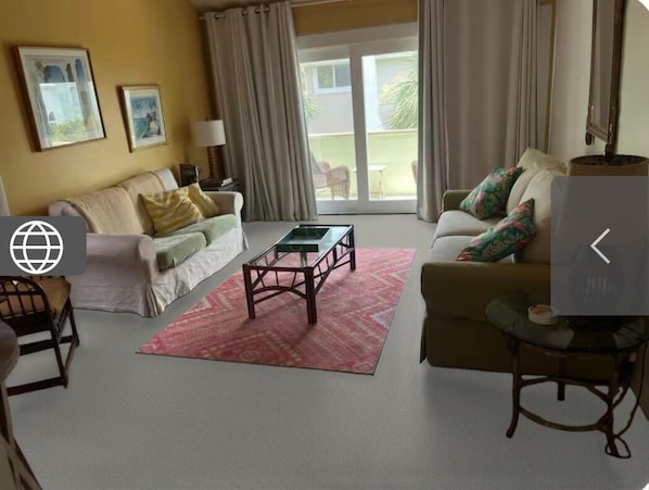 Living room with cathedral ceilings and balcony