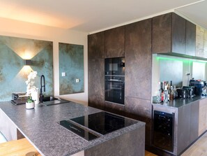 Interior Design, Flooring, Countertop, Kitchen, Wood, Floor, Furniture, Ceiling, Kitchen Appliance, Lighting