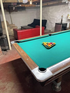 Basement room accessible to all residents in the building. Seating area, washer/dryer, pool table and bar set up.
