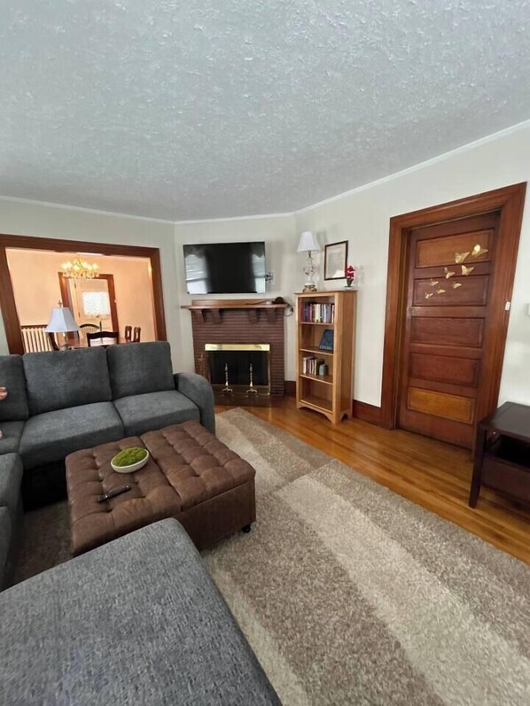 Living room with large sectional for conversations, sleeping and relaxing. Pulls out into a comfortable large sleeping area.