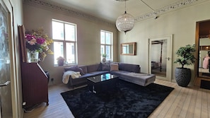 Lounge with spacious sofa and 70 inch tv
