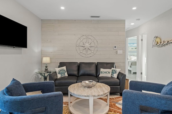 Living room, couch, & smart tv.