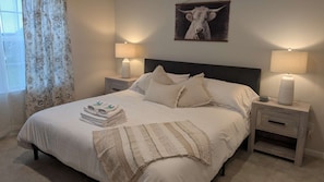 Unwind in the elegant King Master Suite, complete with a cozy king-size bed and relaxing atmosphere. It’s the perfect escape after a long day.
