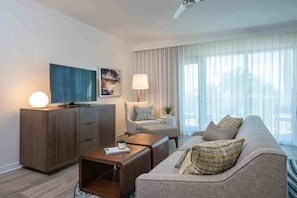 Kick back in a sunlit lounge where relaxed seating and natural textures invite cozy conversations and quiet moments.