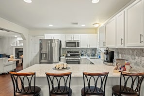 Barstool seating at the kitchen counter for casual dining and easy conversation.