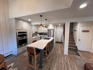 Kitchen with island bar seating