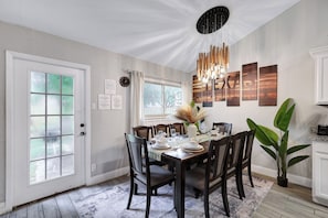 Spacious dining table that sits 8 with full tableware and silverware included.