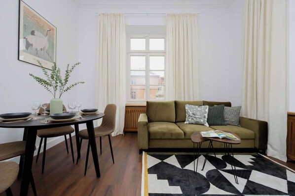Living room with a comfortable sofa and TV. 