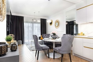 Large table with chairs for eating communal meals. 