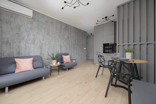 A bright, spacious interior with pastel accents creates the perfect space for relaxation and work.

