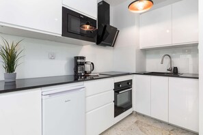 Kitchenette with an oven.