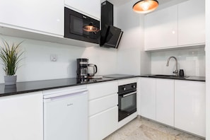Kitchenette with an oven.