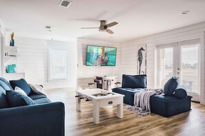 GAME ROOM: Located on the 3rd Floor, features a sit-down Arcade Game with 3,000+ games, Foosball Table, 75" Smart TV, Lounge Seating, Kitchenette, and Balcony with Stunning Sunsets!