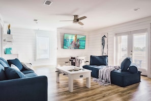 GAME ROOM: Located on the 3rd Floor, features a sit-down Arcade Game with 3,000+ games, Foosball Table, 75" Smart TV, Lounge Seating, Kitchenette, and Balcony with Stunning Sunsets!
