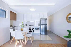Share a meal around the dining table or use this space for setting up a laptop if you’re combining business and leisure.
