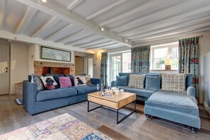 Drift Cottage (Salthouse): Sitting room with wood burning stove, Smart television and doors to the lovely garden