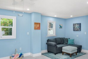 Living room, beach towels in basket on floor