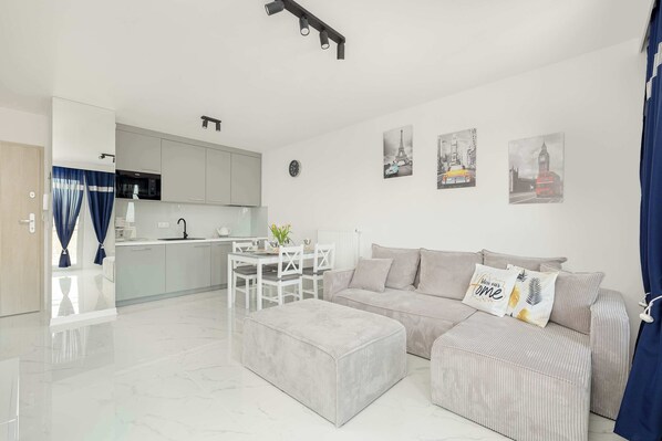 A different perspective of the living room, showing a large open space.