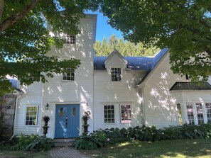 Your rental includes the entire white clapboard house and features 5 bedrooms & 4.5 baths. T
