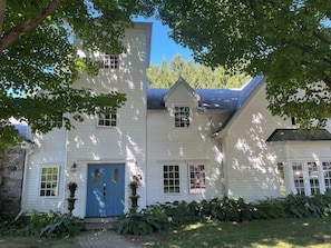 Your rental includes the entire white clapboard house and features 5 bedrooms & 4.5 baths. T