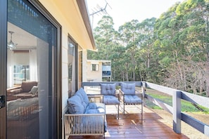 Sink into outdoor seating and soak in the tranquil bush setting from the comfort of your private front deck.
