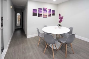 Dining area featuring a tulip design table perfect for a quick bite with family.