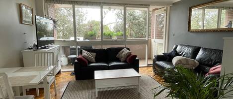 Looking from the kitchen to the lounge room and balcony and nice tree view